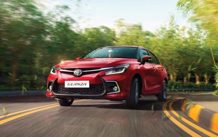 Toyota Glanza cars front grille and headlight close view, best Glanza cars with premium finish, buy Glanza cars for modern design and comfort