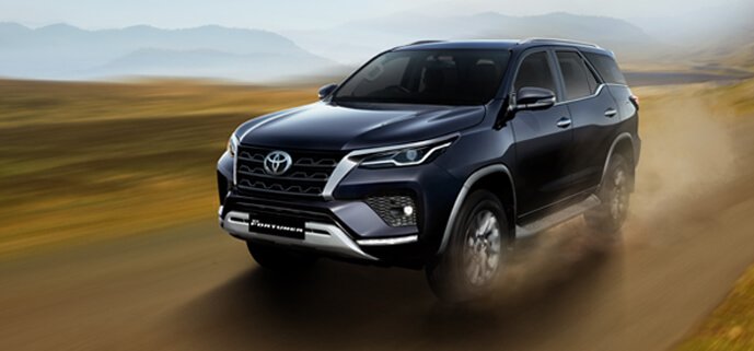 Toyota Fortuner car exterior gallery view highlighting strong body design, modern styling, and premium SUV presence on the road.Toyota Fortuner car exterior gallery view highlighting strong body design, modern styling, and premium SUV presence on the road.