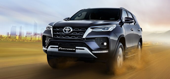 Fortuner car side angle view showing rugged build, stylish body lines, and luxury SUV appeal for customers planning to buy Fortuner car.