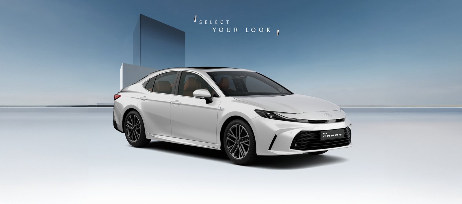 Toyota Camry car in platinum white color displaying premium design, elegant styling, and refined luxury sedan look.