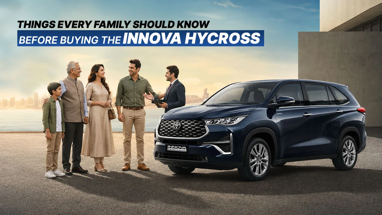 A family meeting a dealer next to a dark blue Toyota vehicle during a Hycross test drive in Chennai.