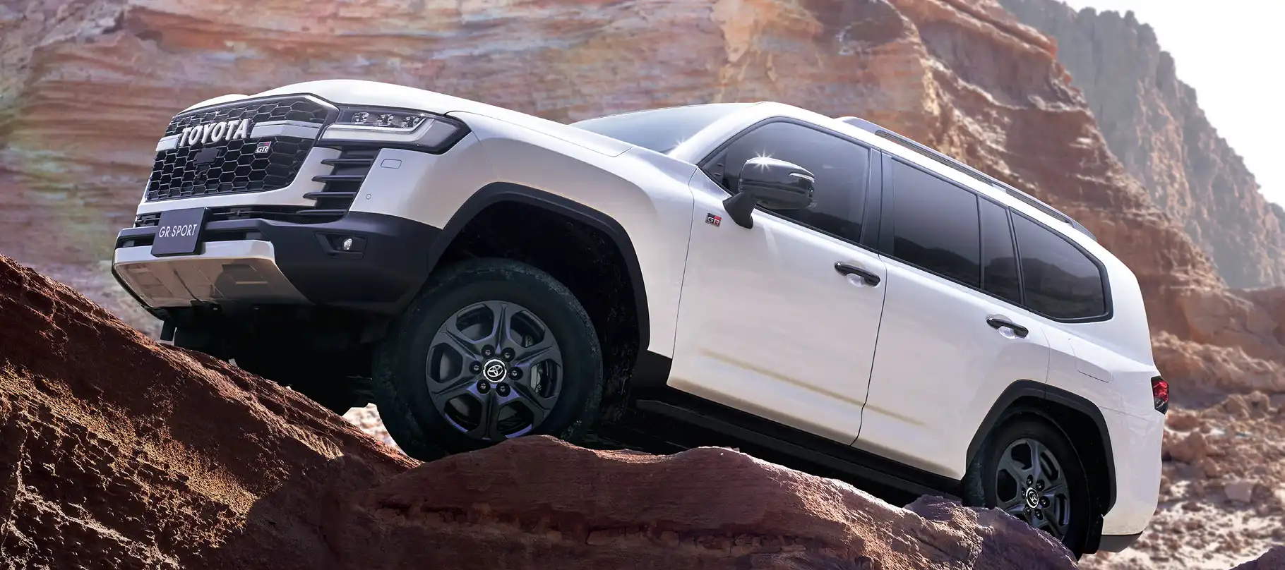 Premium Land Cruiser 300 car exterior gallery image highlighting stylish body lines, bold grille, and strong SUV presence designed for performance and comfort